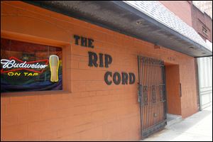 This bar on North Erie Street is a defendant in a lawsuit by Lucas County seeking
payment of fines. The action is on hold pending decision of a case in Columbus.