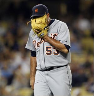 Detroit Tigers relief pitcher Joaquin Benoit walks off the field as he yells into his glove after giving up two runs to the Los Angeles Dodgers during the eighth inning of an interleague baseball game in Los Angele on Monday. Dodgers won the game 4-0.