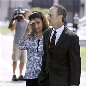 Amera Akl and her attorney, Sanford Schulman, leave U.S. District Court after sentencing in the Hezbollah funding case. 