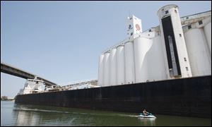 A ship unloads cargo at the General Mills plant in Buffalo, N.Y., in mid-June.