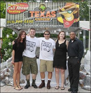 Monica Standohar, from left, Dave Soehnler, Scott Schraeger, and Kendell Carter at the Texas Roadhouse ZOOtoDO booth.