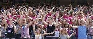 Gymnasts from around the country sing 'YMCA'  at Fifth Third Field Wednesday, June 22.