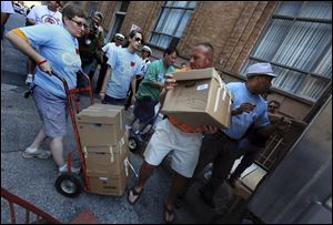 Opponents of Ohio's Senate Bill 5 deliver some of the 1.3 million petition signatures to the Ohio Secretary of State's office in Columbus. The new law would restrict collective-bargaining power of public employees.