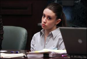 Casey Anthony listens Thursday during testimony in her murder trial at the Orange County Courthouse in Orlando, Fla. 