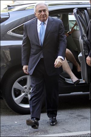 Former International Monetary Fund leader Dominique Strauss-Kahn arrives Friday at New York Supreme Court.