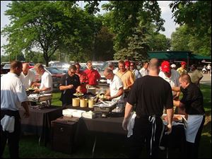 D.O.V.E. golfers enjoy a buffet dinner after their round.