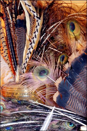 Feathers and animal hair that Dave Asproth uses to tie flys are almost everywhere in his home just outside of Grand Marais, Minnesota.