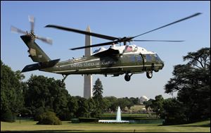 The Marine One helicopter ferries President Obama to Camp David, where he'll spend the July Fourth holiday.