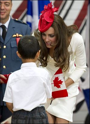 The Duchess of Cambridge greets a young, newly sworn-in Canadian citizen during a citizenship ceremony.