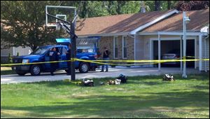 Fire investigators gather at the scene in Sylvania Township.