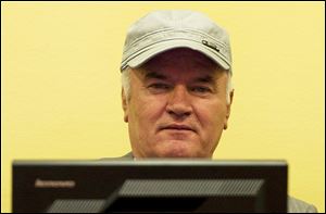 Former Bosnian Serb military chief Ratko Mladic sits in the court room during his further initial appearance at the U.N.'s Yugoslav war crimes tribunal in The Hague, Netherlands.