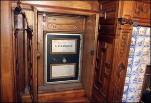 Hidden behind paneling in the dining room is a safe that bears the initials and last name of Edward Drummond Libbey, who built the house. A foundation is raising money for the home's restoration.