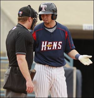 The Hens' Cale Iorg argues a called strike with home plate umpire Toby Basner.