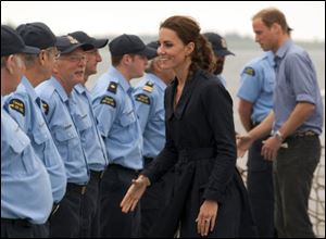 Prince William and Catherine, the Duke and Duchess of Cambridge, greet the crew of the Canadian Coast Guard Cutter Edward Cornwallis Monday.
