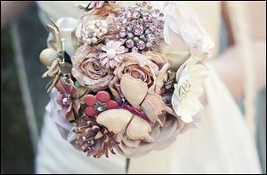 A bouquet is created out of vintage brooches.