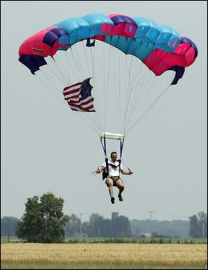 Rod Collin of Sky Dive Tecumseh performs in a parachute demonstration.