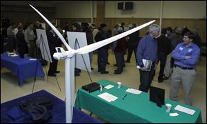 A wind turbine is modeled during Blissfield Wind Energy project team open house at the Blissfield American Legion in Michigan in March.