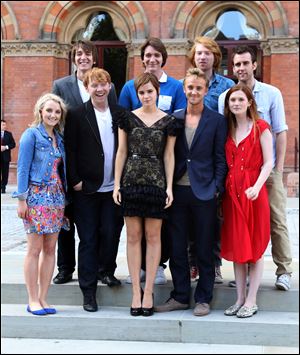 Back, from left, Oliver Phelps, James Phelps, Domhnall Gleeson, Matthew Lewis, and front, from left, Evanna Lynch, Rupert Grint, Emma Watson, Tom Felton, Bonnie Wright attend a photocall for 'Harry Potter and the Deathly Hallows: Part 2' at The Renaissance St Pancras Hotel.