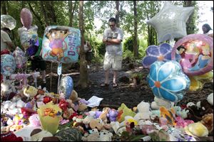 Corey Stroud prays Wednesday at a Caylee Anthony memorial in Orlando, Fla.