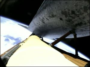 The shuttle Atlantis is shown in this video moments before it separates from the main fuel tank.