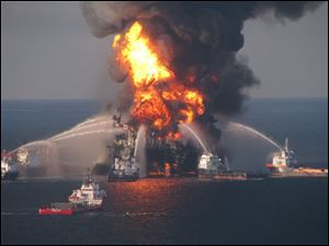 In this April 21, 2010 file image provided by the U.S. Coast Guard, fire boat response crews battle the blazing remnants of the off shore oil rig Deepwater Horizon.  