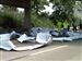 Road workers clean up unraveled spools of aluminum on the entrance ramp to I-280 from southbound I-75.