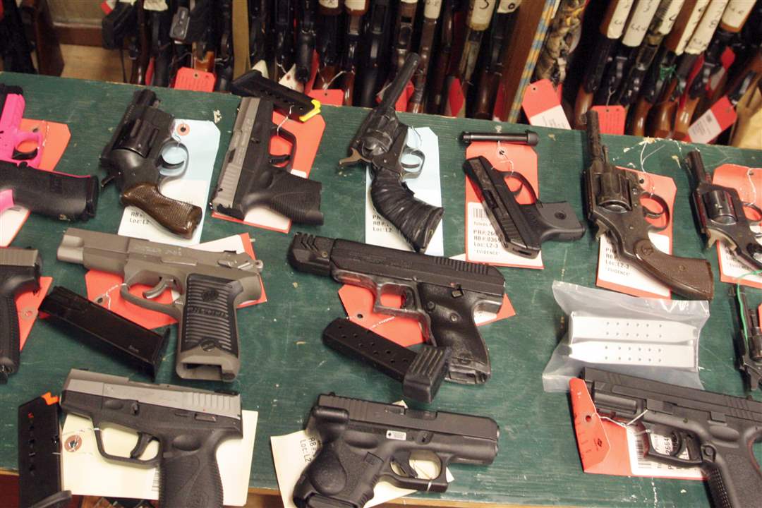 Table-of-guns-confiscated-over-4th-of-July