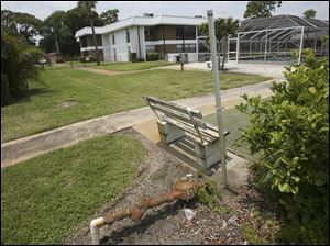 A rusting pipe is among plumbing problems at Inlet House in Florida. The homeowner association has assessed $6,000 a condo for plumbing repairs and has foreclosed on residents who haven't paid.