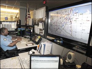 EMS dispatcher Harold McWilliams works at the Lucas County 911 command center, which is undergoing an upgrade of its communications system.
