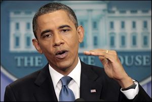 President Barack Obama talks about the ongoing budget negotiations Monday in the briefing room of the White House in Washington. 