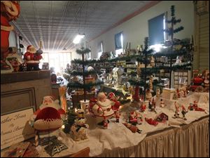 Christmas decorations line Beeker's General Store in Pemberville in celebration of the village's Christmas in July event.
