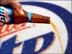 The 'Vortex' bottle created by Owens-Illinois Inc. lets beer spiral into the glass.