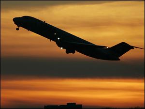 A plane takes off from Minneapolis St. Paul International Airport in Minneapolis in this file photo.