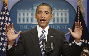 President Barack Obama answers questions on the ongoing budget negotiations Friday during a press conference in the Brady Briefing Room of the White House.