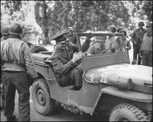 Gen. Dwight D. Eisenhower sits in a jeep at a front line position in France in September 1944. 