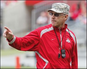 Then Ohio State football head coach Jim Tressel gives instructions during a spring game in Columbus in this April 23, 2011, file photo. 
