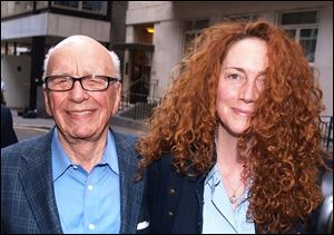 Rupert Murdoch, left, chairman of News Corp., left, and Rebekah Brooks, then chief executive of News International, leave his residence in central London earlier this month.