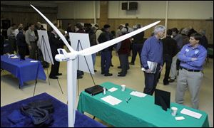 A model of a wind turbine is displayed during the Blissfield Wind Energy project team open house.