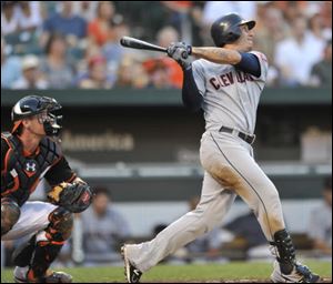 Cleveland Indians' Asdrubal Cabrera, right, follows through on a two-run home run against the Baltimore Orioles in the third inning Friday.