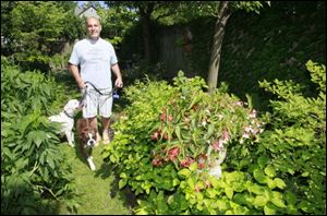 Dave Urbank in his garden in the Old West End.