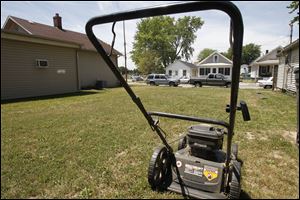 The just-mowed vacant lot in the 1400 block of Harrison Street might qualify for Mow to Own if an adjacent homeowner enrolls in the Sandusky program.