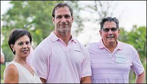 Debbie Knight, Chris Spielman, center, and Dr. Robin Shermis at the putting tournament at Belmont Country Club.