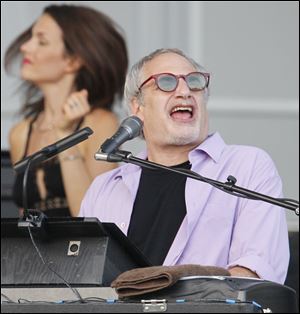 Donald Fagen of Steely Dan performs in front of a crowd of 4,100 concertgoers at the Toledo Zoo.