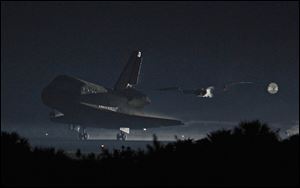 Space shuttle Atlantis lands Thursday at the Kennedy Space Center in Cape Canaveral, Fla..