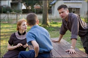 Brad Pitt, right, stars in 'The Tree of Life' with Jessica Chastain, left, and Tye Sheridan.