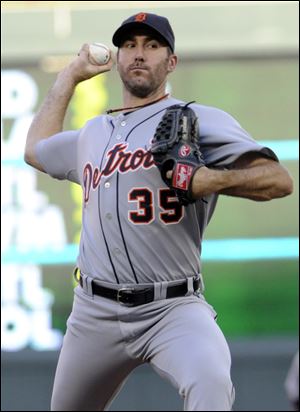 Detroit Tigers pitcher Justin Verlander throws against the Minnesota Twins in the first inning Thursday night.