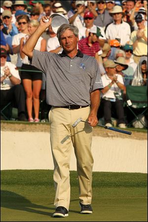 Fred Couples waves to fans after finishing on the 18th hole during the final round of the 2011 Masters Tournament at Augusta National Golf Club in April.