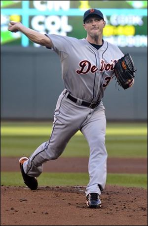 The Tigers' Max Scherzer pitches against the Twins during the first inning.