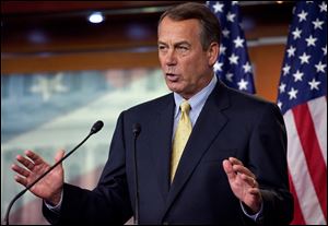 House Speaker John Boehner of Ohio talks about the break down of debt ceiling talks with the White House during a news conference Friday on Capitol Hill.