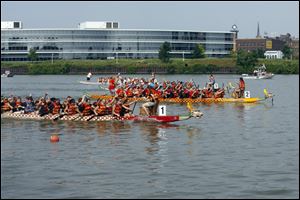 Dragon boat racing teams of 25 people -- 20 paddlers, a steersman, a drummer, and three alternates -- raised a minimum of $2,000 to participate in three races during the day, with the first-round times determining their placement in the next two rounds.